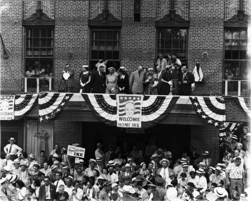 Dwight D. Eisenhower views the homecoming parade In Abilene, Kansas. June 6, 1952. Photo by Lester Green. [64-555-2]